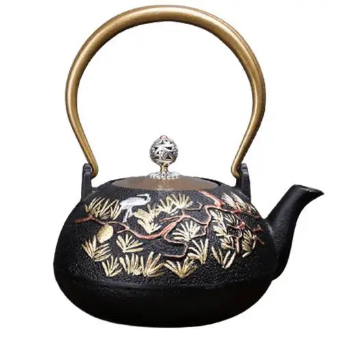 Cast iron teapot with pine tree and bird design