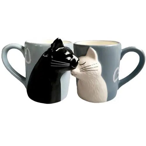 Cat couple mugs showing complementary raised relief design together