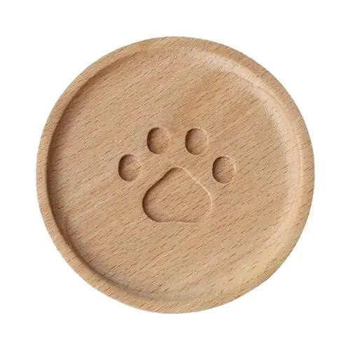 Cat paw coaster set on wooden table