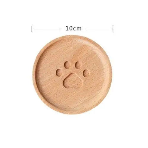 Cat paw coaster size comparison with cup