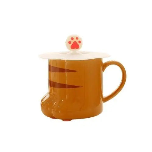 Brown cat paw porcelain tea cup with cream paw pad details and lid