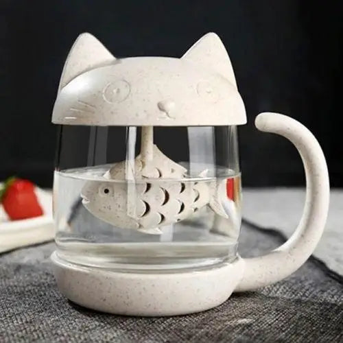 Clear glass cat tea cup with infuser in use, tea steeping