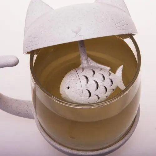 Cat tea cup with fish infuser, tea color visible through glass