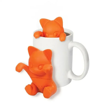 Cat tea infuser in orange silicone on a mug