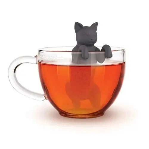 Gray cat tea infuser sitting on a mug of tea
