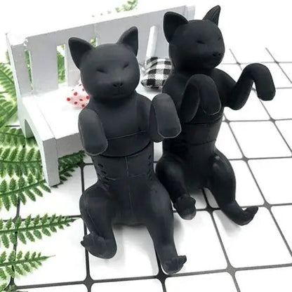 Two cat tea infusers in gray and black