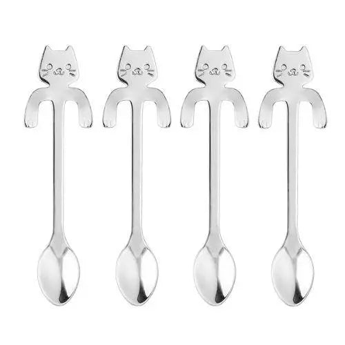 Close-up of cat-shaped handle on stainless steel tea spoon