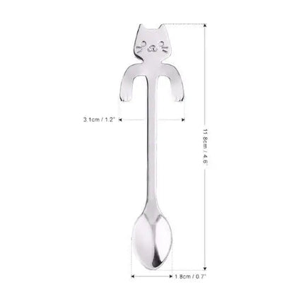 Cat tea spoon shown next to ruler to show 4.6 inch length