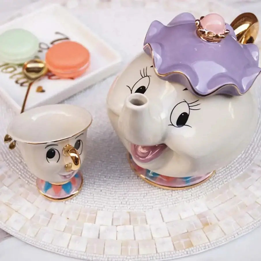 Ceramic teapot with elephant design and cups