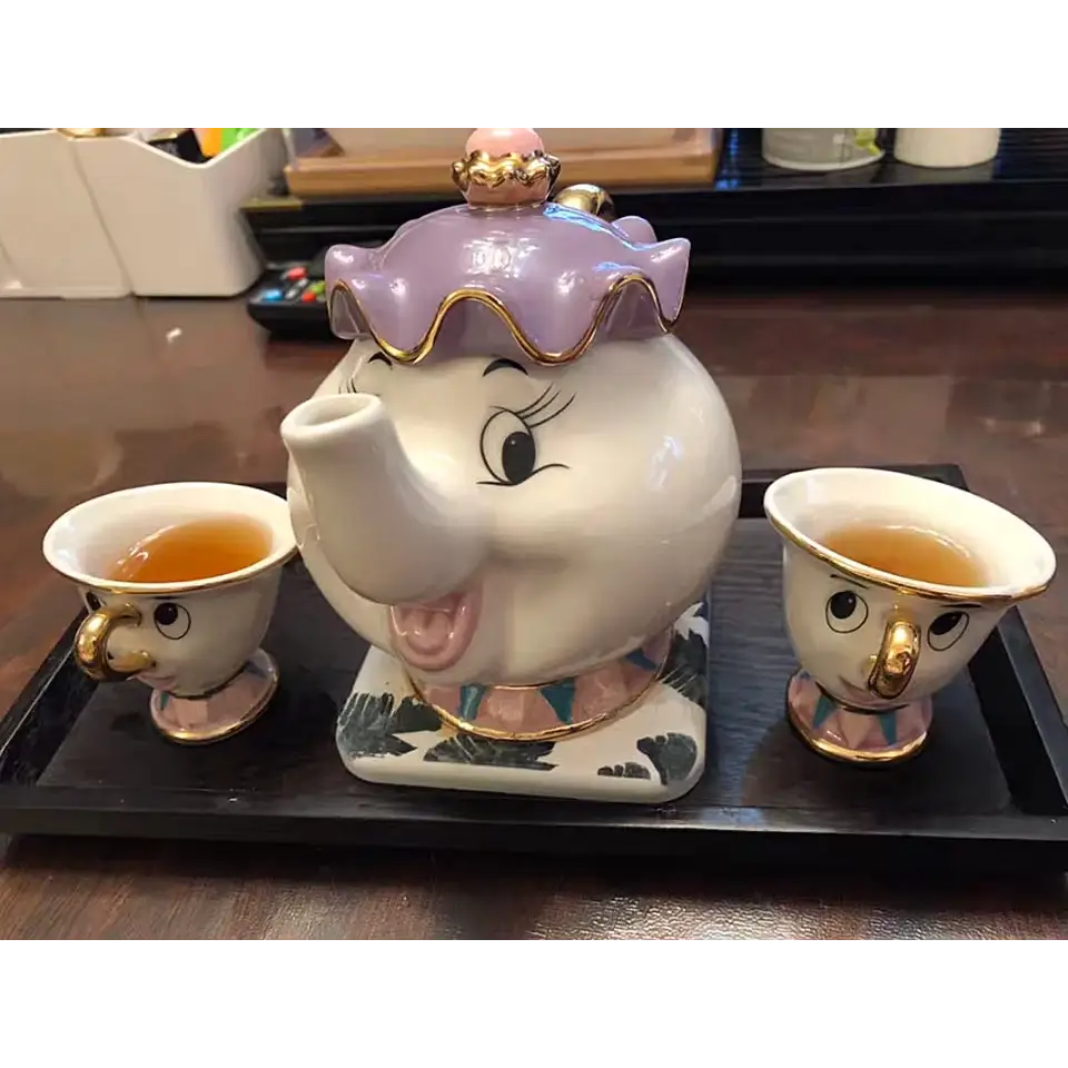 Ceramic teapot set with elephant motif and cups