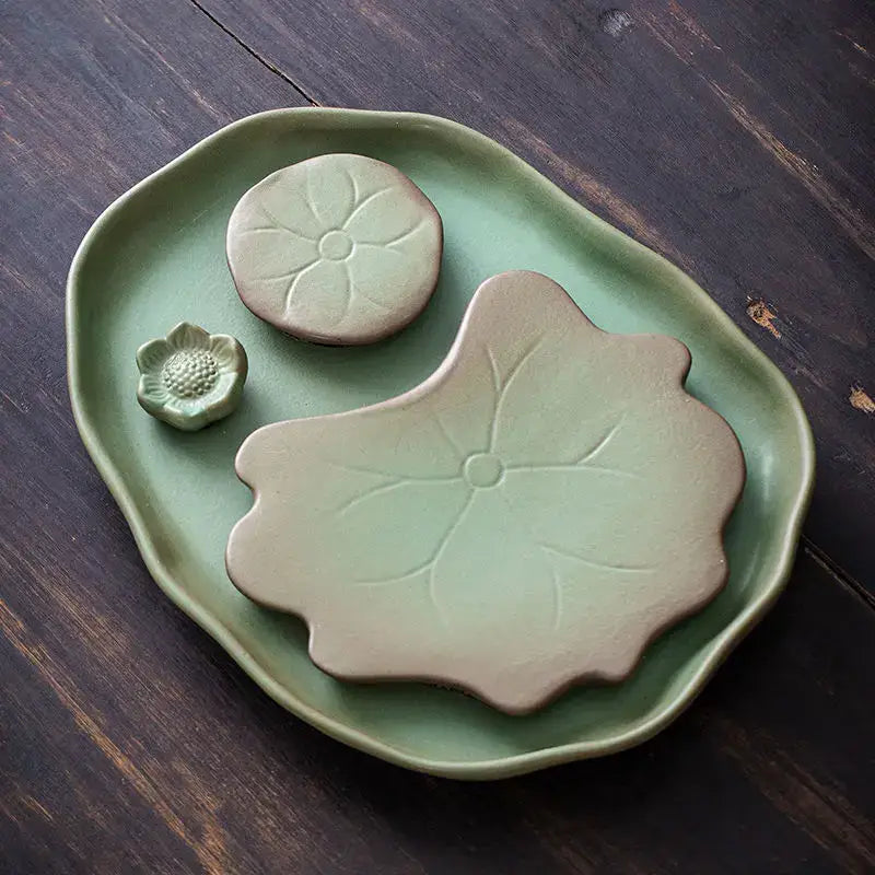 Green ceramic leaf tea tray with teapot and cup