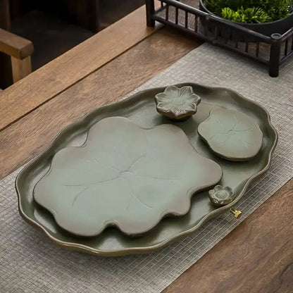 Ceramic leaf tea tray with tea set from above