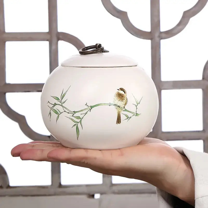 Airtight ceramic tea canister with lid open showing interior storage space