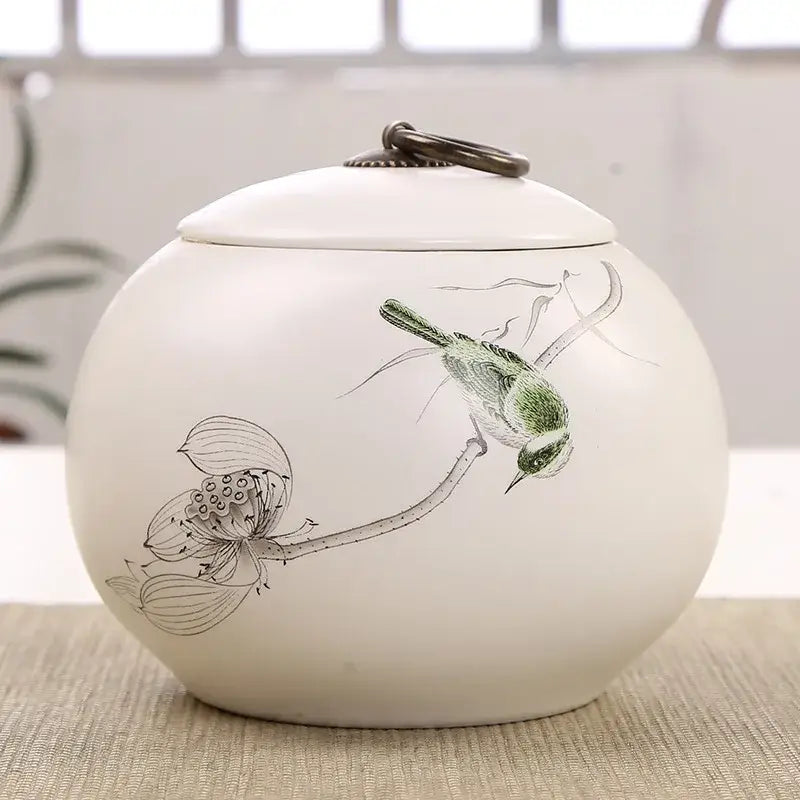 Hand-painted flower motif ceramic tea canister, close-up of painted detail