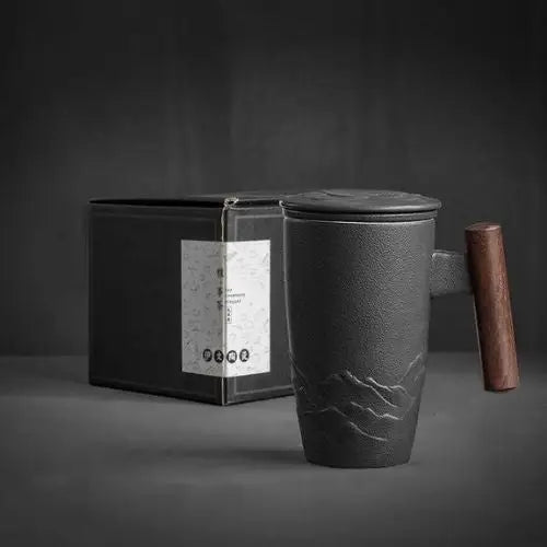 Black ceramic tea infuser mug with lid and wooden handle