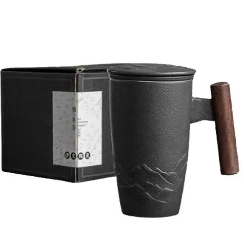 Ceramic tea mug with built-in strainer and wooden handle