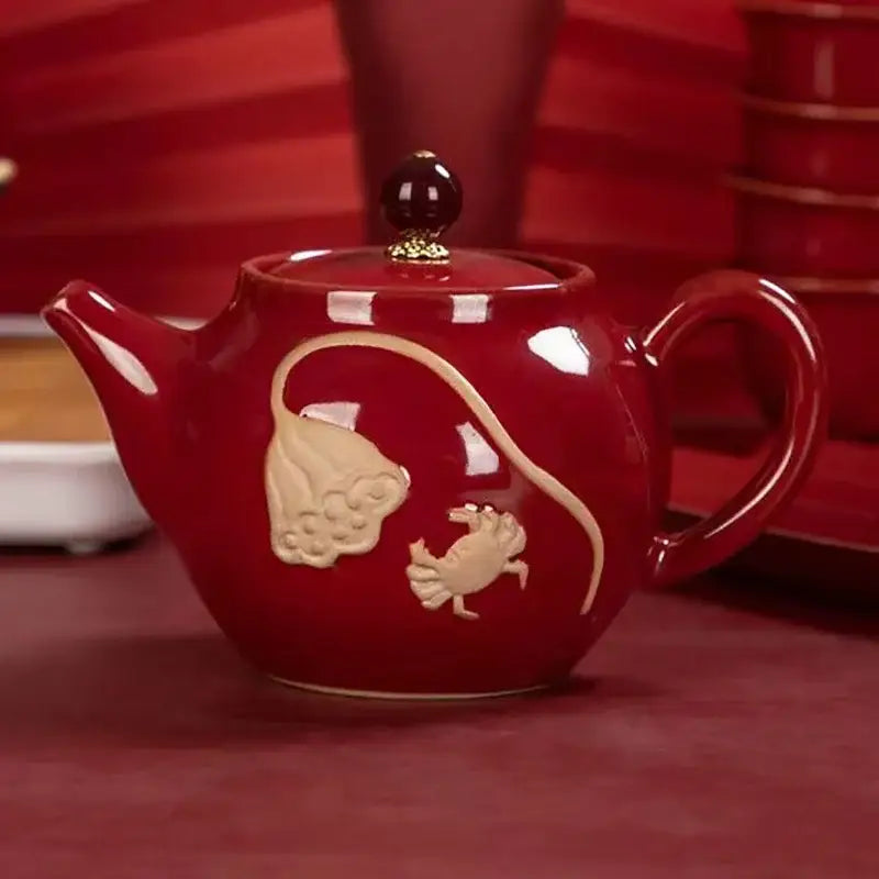 Red ceramic teapot for one with cup