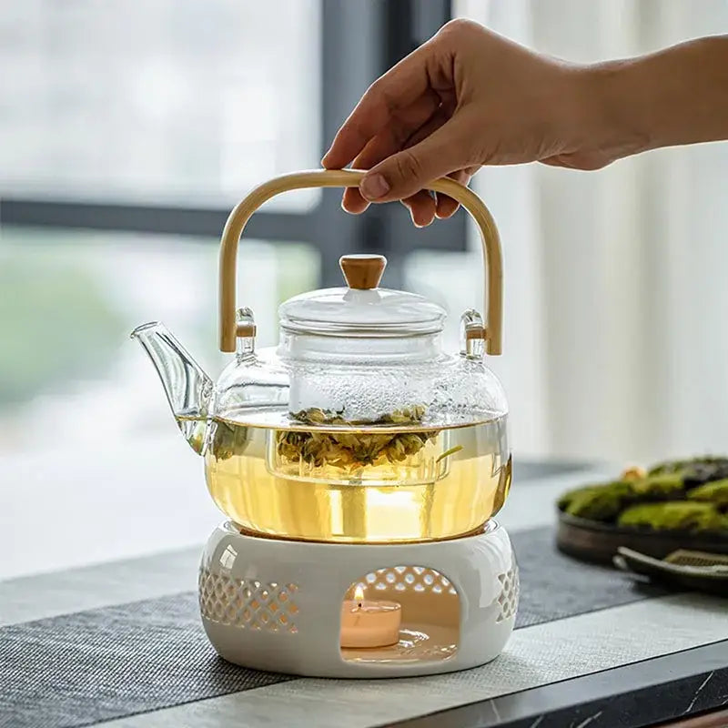 Ceramic teapot warmer holding a teapot warm on a table