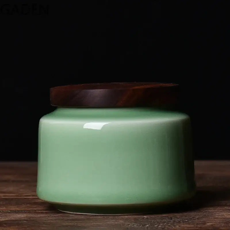Light blue ceramic tea canister with traditional Chinese pattern and lid