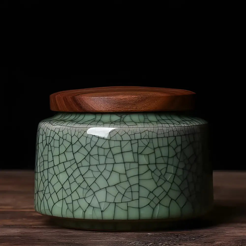 Dark green patterned ceramic tea canister airtight lid closed front view