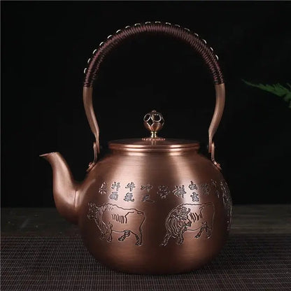 Chinese copper teapot 1.5 L - hand-carved bull motif detail in warm copper finish