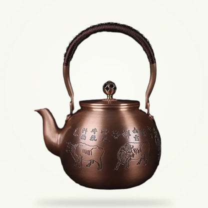 Handcrafted Chinese copper teapot with bull motif, 1.5 L, on plain background