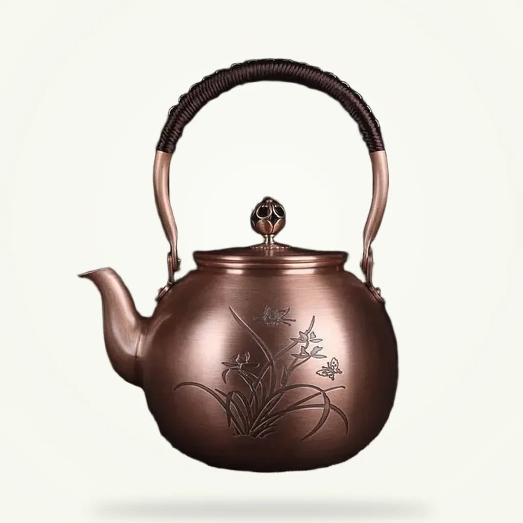 Chinese copper teapot with butterfly motif, 1.5L, warm reddish-gold finish, white background