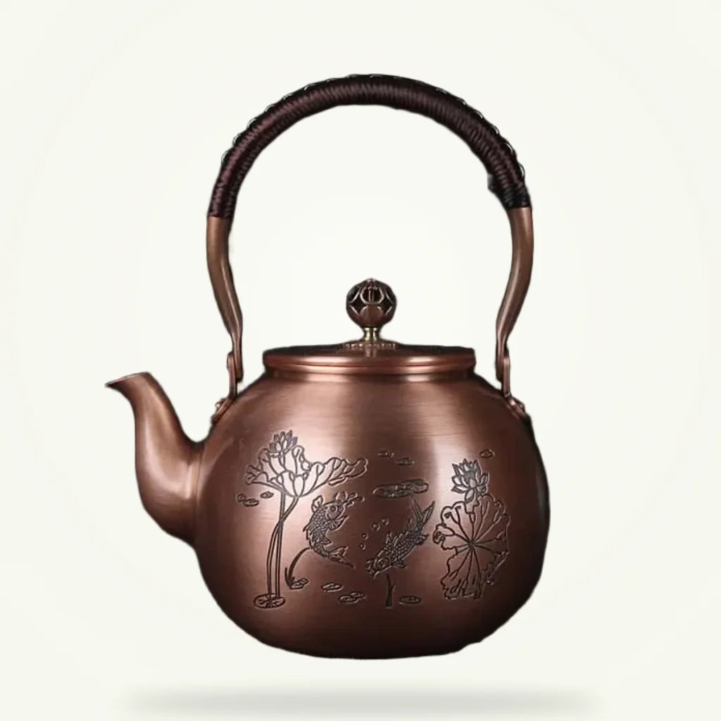 Chinese copper teapot with fish motif, 1.5L, front view on plain background