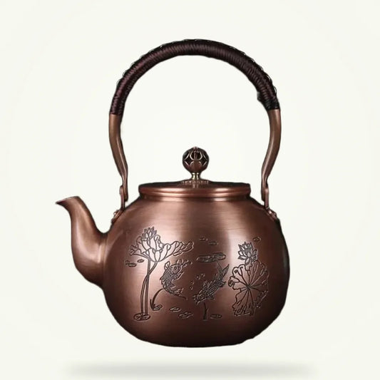 Chinese copper teapot with fish motif, 1.5L, front view on plain background