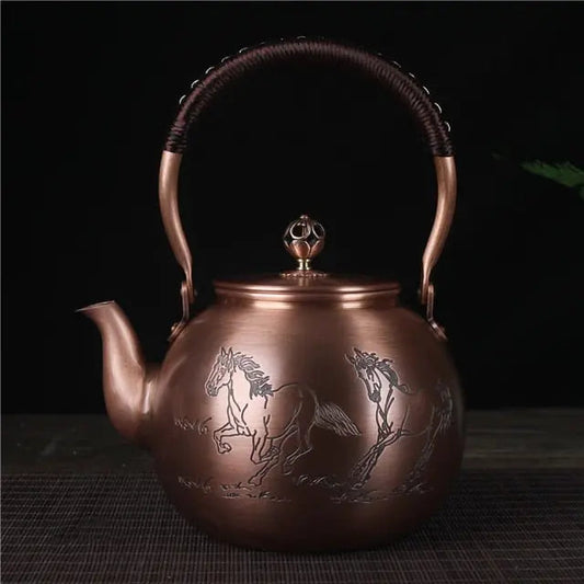 Round Chinese copper teapot with hand-chased horse relief design, 1.5L side view