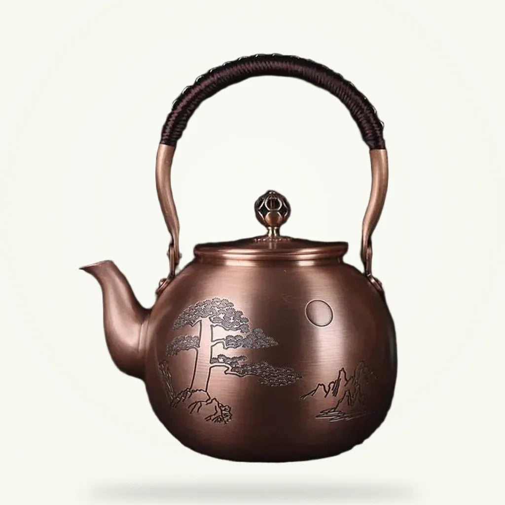 Chinese copper teapot with engraved moon motif, 1.5L, front view on plain background
