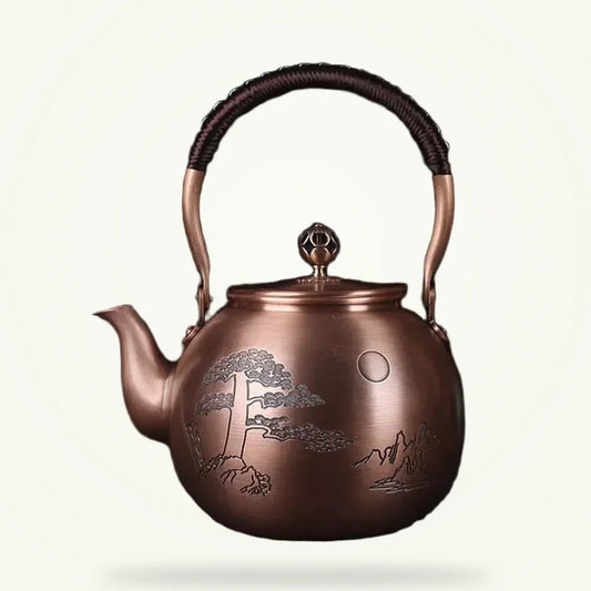 Chinese copper teapot with engraved moon motif, 1.5L, front view on plain background