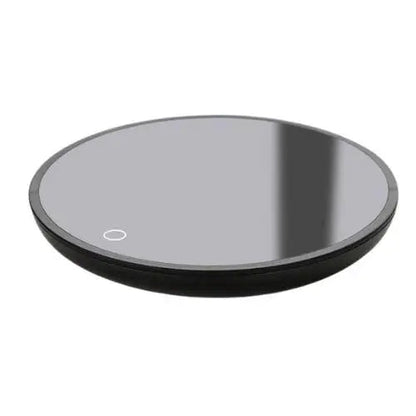 Black mug warmer on office desk