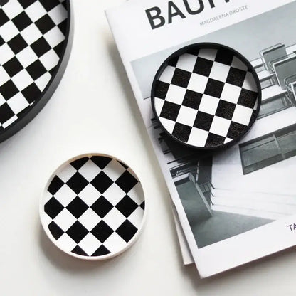 Black and white coffee saucer set on table