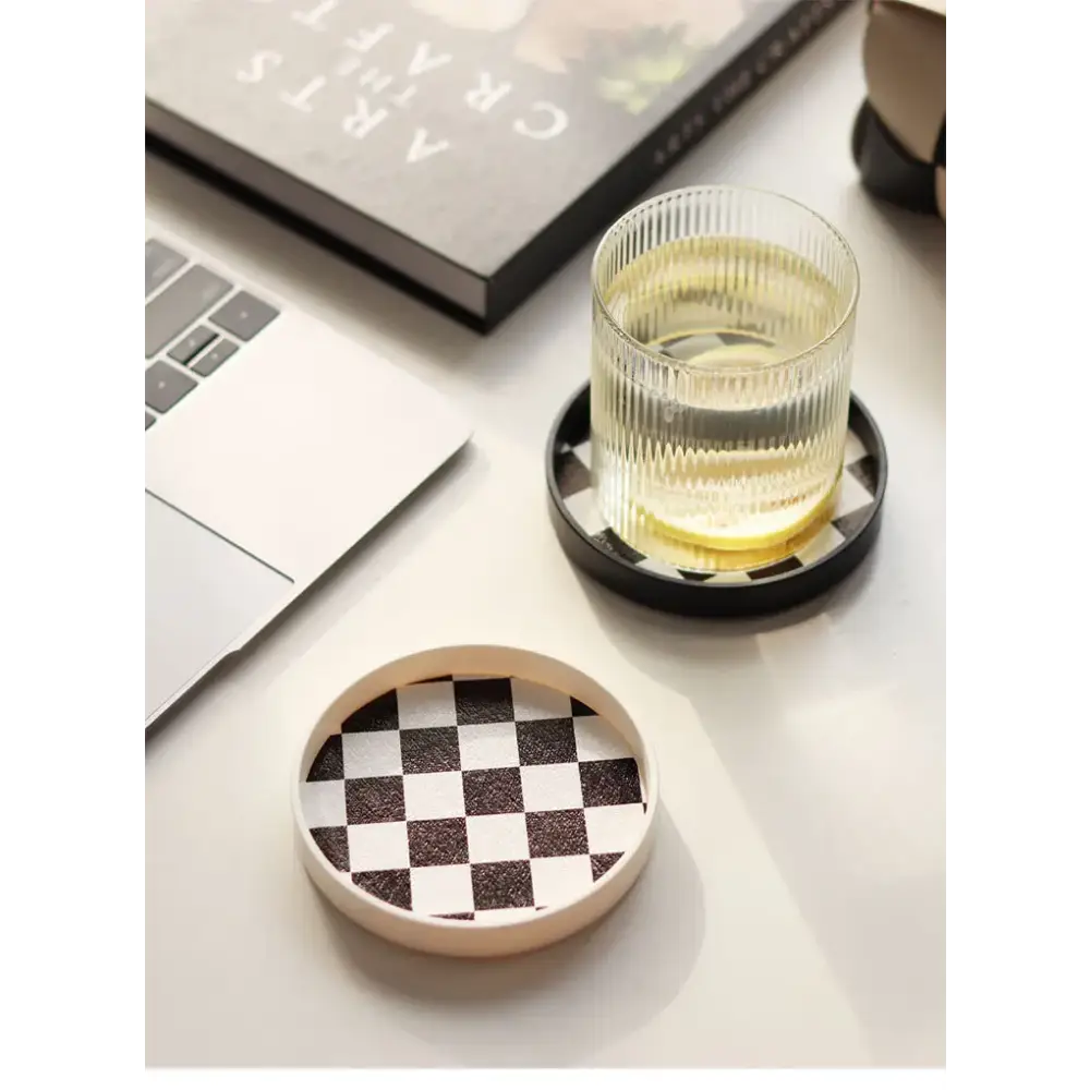 Black and white saucers with coffee pot