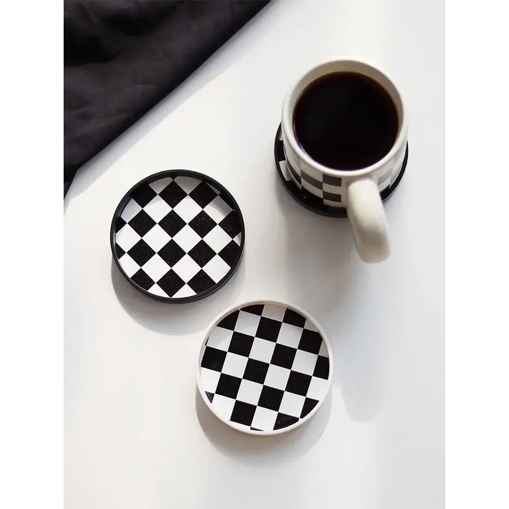 Coffee saucer with mug on wooden table