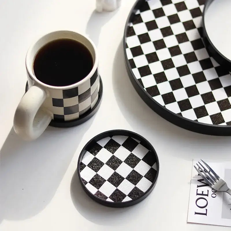 Stack of black and white saucers