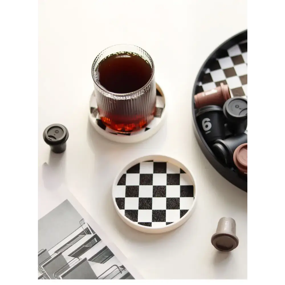 Saucer with cup of coffee on table