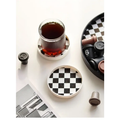 Saucer with cup of coffee on table