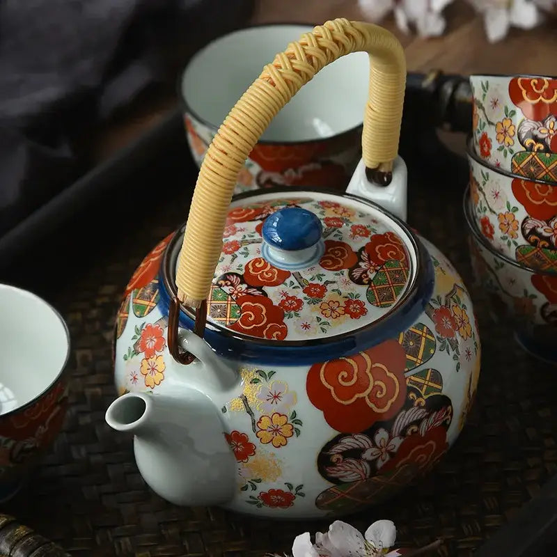 Hand-painted ceramic teapot with built-in strainer