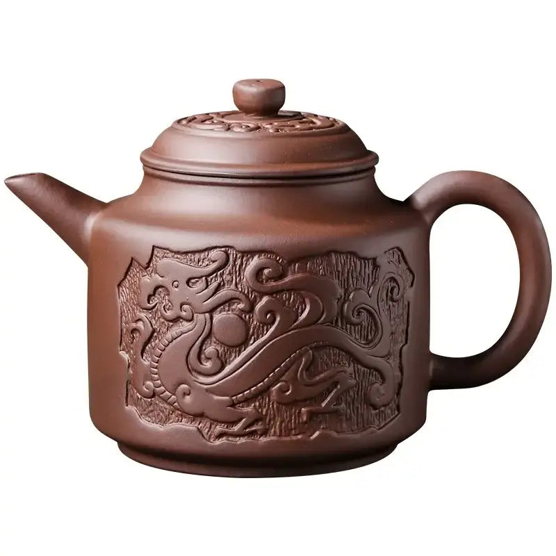 Ceramic teapot with matching cup, traditional design