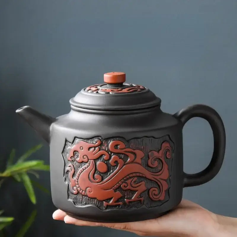 Ceramic teapot with tea cup and loose leaf tea