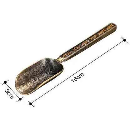 Copper tea spoon with loose leaf tea