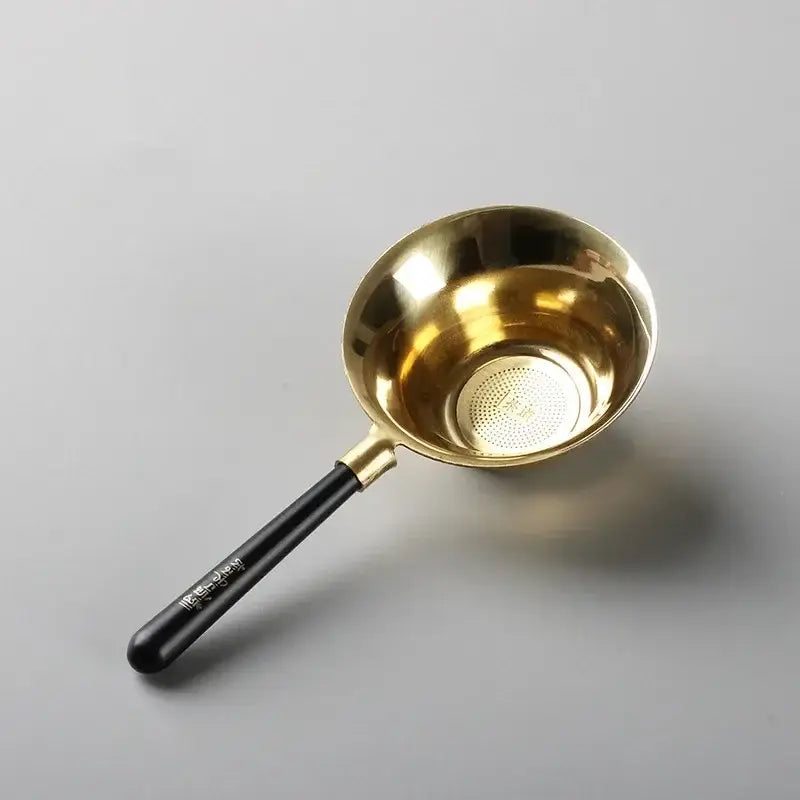 Close-up of copper tea strainer showing mesh