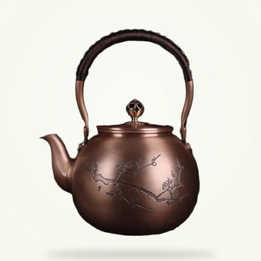 Copper teapot with hand-engraved cherry blossom motif, 1.5L, front view on plain background