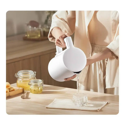 Close-up of food-grade stainless steel interior of cordless electric kettle
