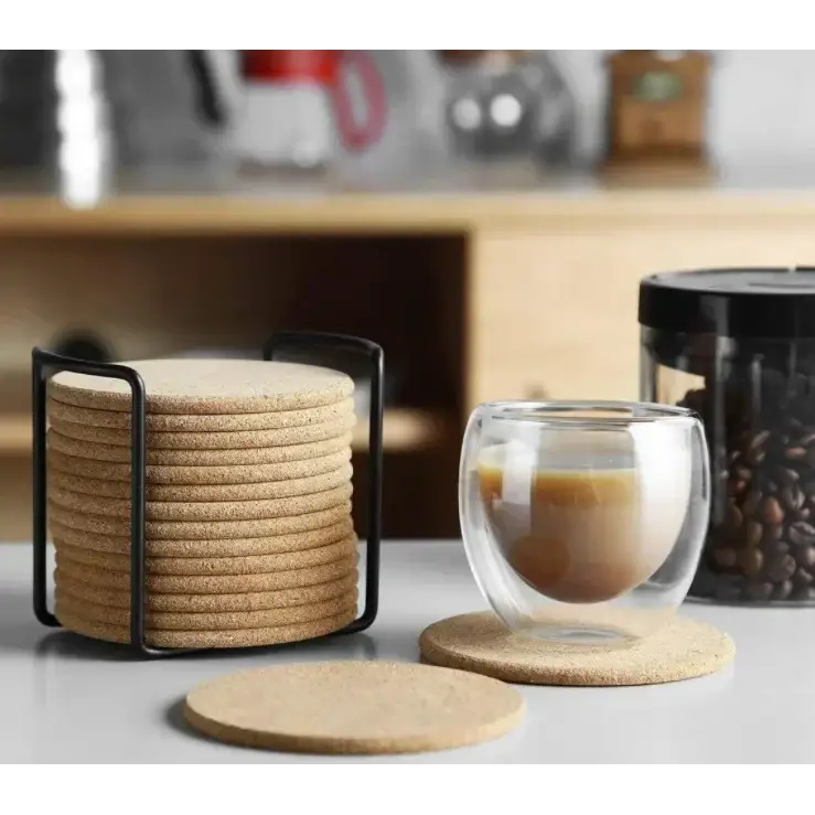 Round cork coasters for tea cups on a wooden table
