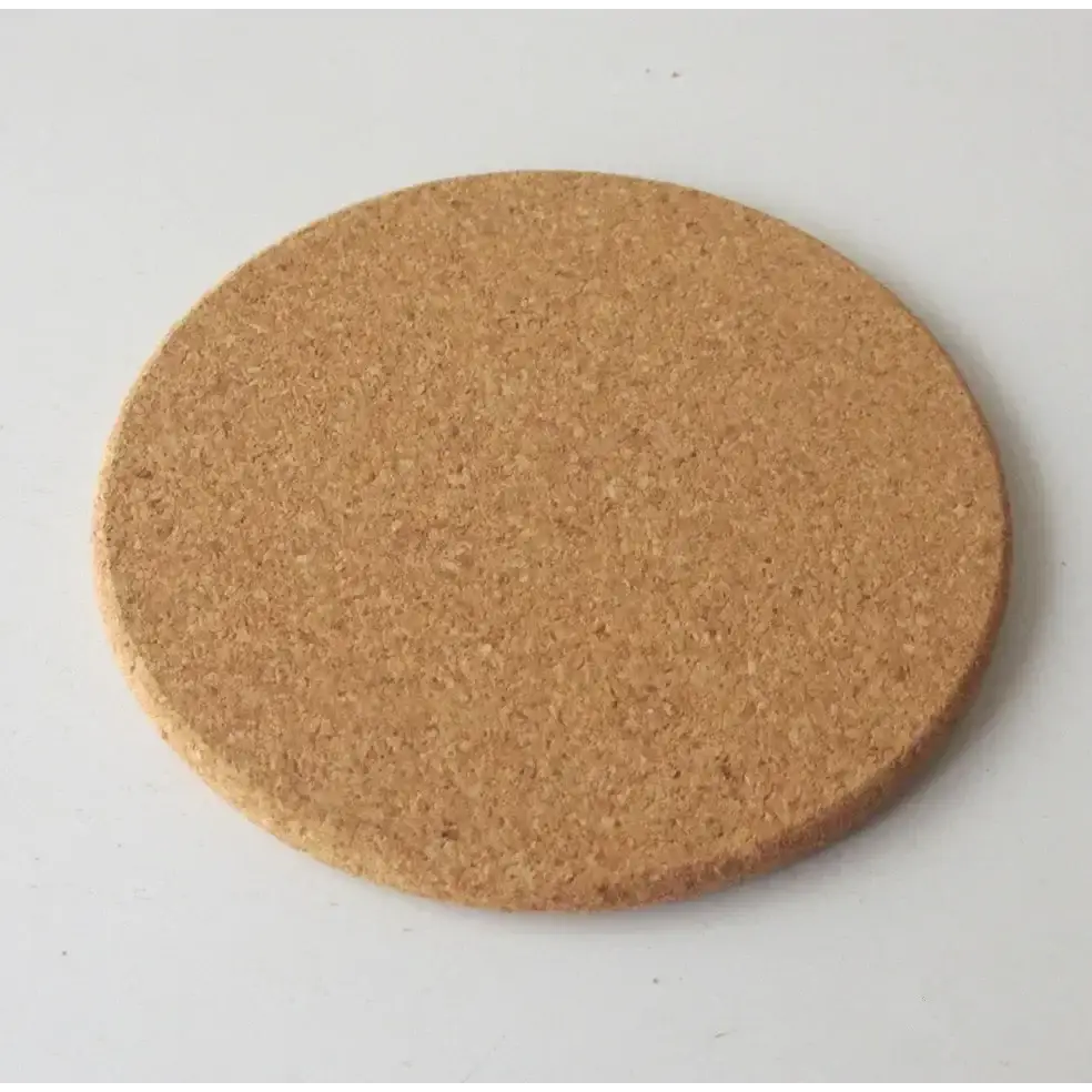 Natural cork coasters protecting a glass table