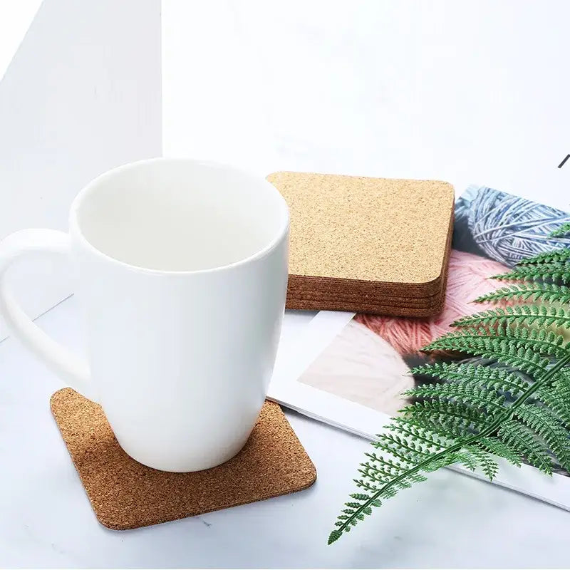 Cork coasters with a teapot and cup on a tray