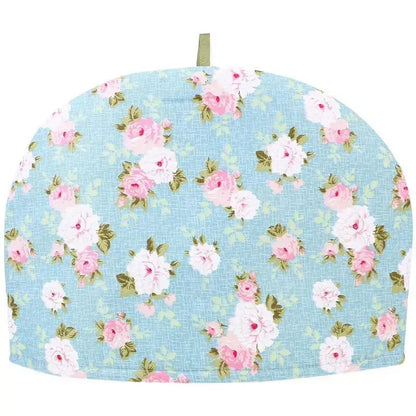 Blue cotton teapot cozy wrapped around a teapot ready to serve
